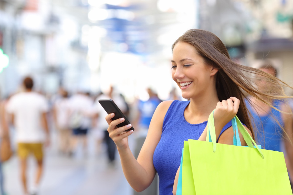 Shopper woman shopping with a smartphone, representing mobile marketing