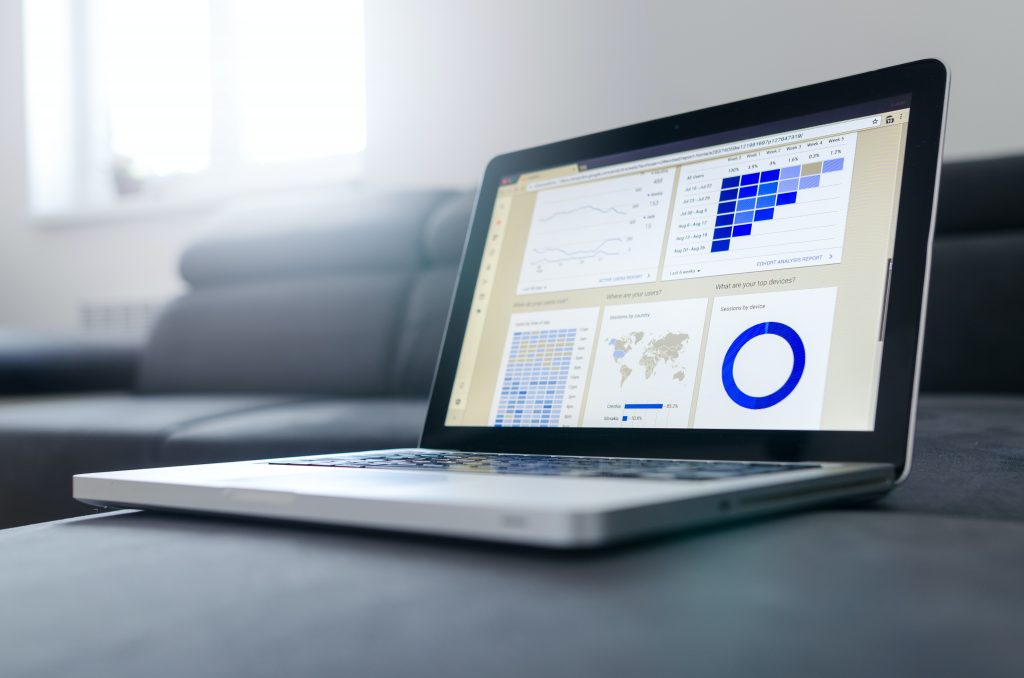 Computer with Google Analytics Charts on the computer screen.